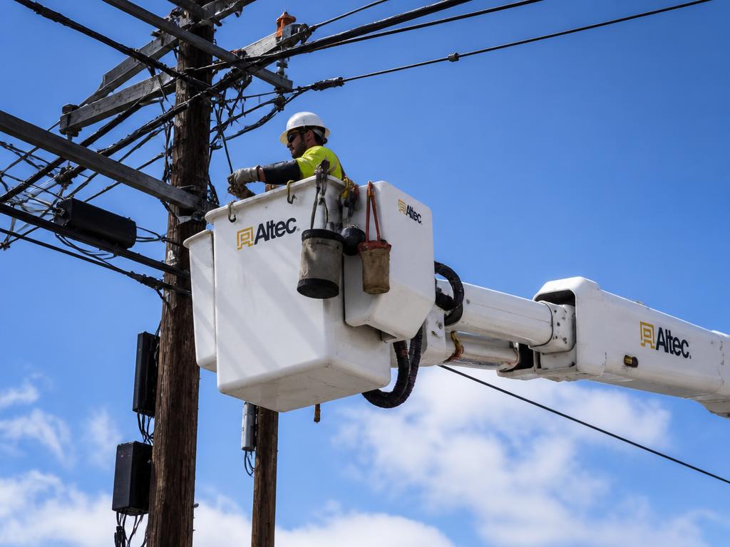 Bucket truck working on aerial fiber optic cables